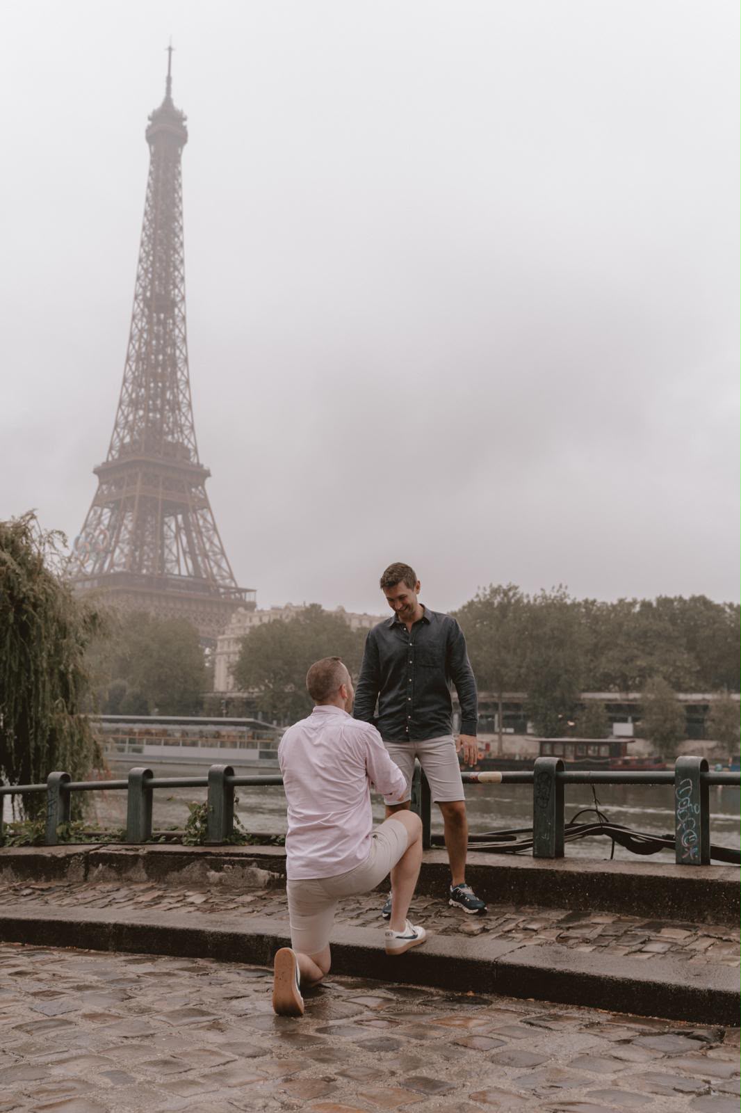 A proposal beside the Seine, with the Eiffel Tower in the background.